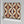 Hourglass wallpaper by Liberty James Studio in red and navy, sample roll showing a retro hourglass wave