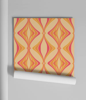 Hourglass wallpaper by Liberty James Studio in orange and pink, partly unrolled roll showing a retro hourglass wave