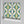 Hourglass wallpaper by Liberty James Studio in turquoise and yellow, roll showing a retro hourglass wave
