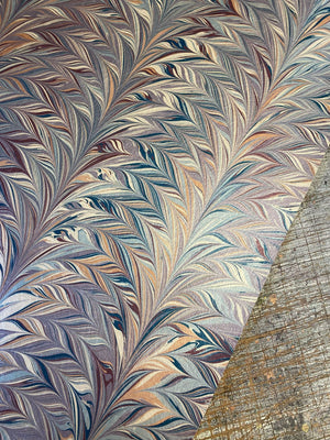 Foxtail Woodstock wallpaper by House of Amitié in blue and gold, roll showing combed marbling