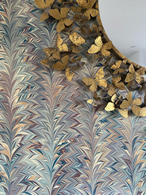 Foxtail Woodstock wallpaper by House of Amitié in blue and gold, close-up of combed marbling