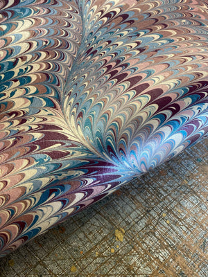 Pirouette in Berry Imperial wallpaper by House of Amitié in pink and blue, flat sample of combed marbling