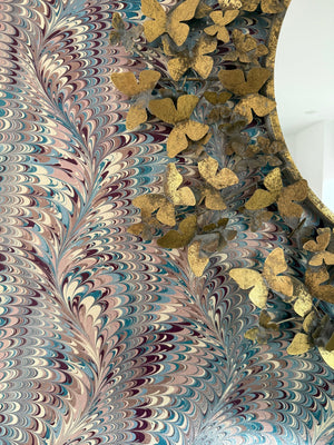 Pirouette in Berry Imperial wallpaper by House of Amitié in pink and blue, close-up of combed marbling