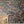 Dusk Tourmaline wallpaper by House of Amitié in purple and green, full repeat of hand-marbled swirls