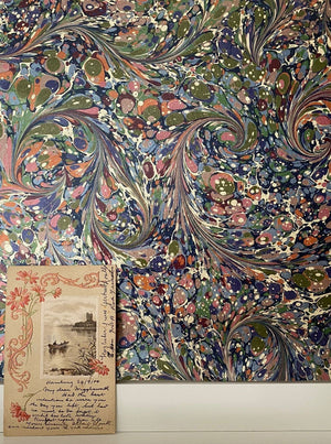 Dusk Tourmaline wallpaper by House of Amitié in purple and green, full repeat of hand-marbled swirls