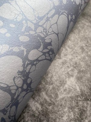 Moucheté wallpaper by House of Amitié in blue, flat sample of soft marbled spots