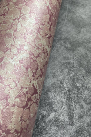 Ditzy wallpaper by House of Amitié in pink, sample roll showing fine hand-marbled pattern