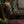 How the Leopard Got His Spots velvet by The Monkey Puzzle Tree in green and orange covering an armchair