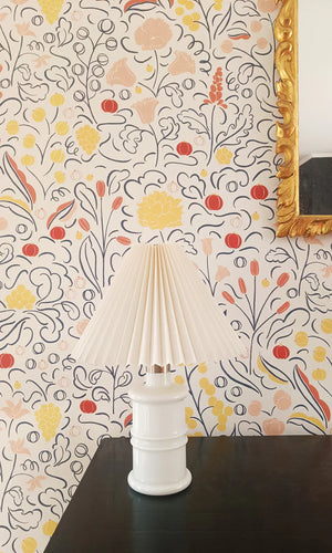 Beatrice wallpaper by Claire de Quénetain in red, a hand-painted floral design in a styled room setting