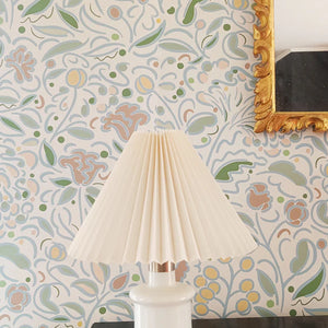 Barbara wallpaper by Claire de Quénetain in pink, a hand-painted floral design above a sideboard