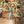 Raven wallpaper by Tamlyn in ivory, ravens among autumn leaves behind a bed