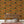 Raven wallpaper by Tamlyn in orange, ravens among autumn leaves above a sideboard