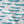 Swimming Sardines fabric by Seed Home Designs in blue and white, draped, showing swimming sardines