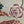 Eversley Grasscloth grasscloth by Parker and Jules in pink and brown, in soft folds showing trailing roses