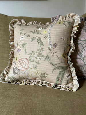 Eversley linen by Parker and Jules in beige and green, trailing roses on a scatter cushion
