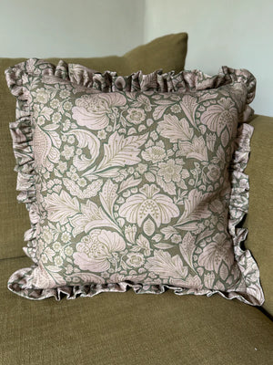 Folk Floral linen by Parker and Jules in brown, bold folk flowers made into a cushion