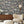 Instrumental wallpaper by Brand McKenzie in charcoal, musicians and instruments behind a console table