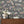 Instrumental wallpaper by Brand McKenzie in charcoal, musicians and instruments above a sideboard