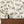 Instrumental wallpaper by Brand McKenzie in terracotta, musicians and instruments in a living room