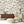 Instrumental wallpaper by Brand McKenzie in cream, musicians and instruments behind a sofa in a living room