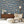 Instrumental wallpaper by Brand McKenzie in blue, musicians and instruments in a living room
