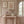 Jaipur wallpaper by Annika Reed in pink, block-print medallions in a hallway