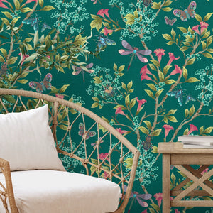 Jewel a Flutter wallpaper by Brand McKenzie in teal and coral, birds and blossoms behind a sofa in a living room