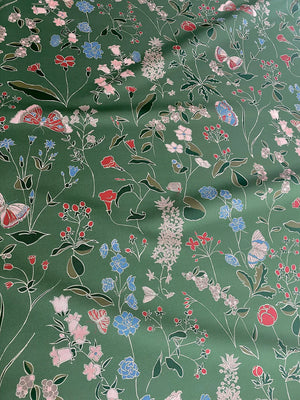 Josepha wallpaper by Claire de Quénetain in green, pattern sample of scattered flowers and birds