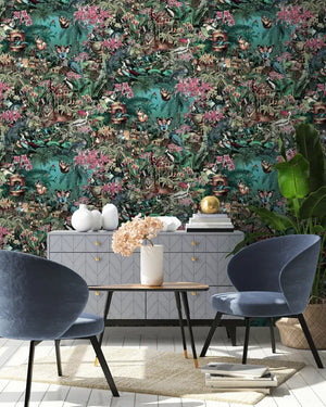 Jungle Life wallpaper by Brand McKenzie in dark green and pink, jungle animals in dense foliage behind a dining table