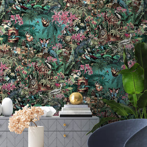 Jungle Life wallpaper by Brand McKenzie in pink and turquoise, pattern detail of jungle animals in dense foliage