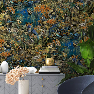 Jungle Life wallpaper by Brand McKenzie in orange and blue, detail of jungle animals in dense foliage