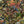 Jungle Life wallpaper by Brand McKenzie in orange, pattern detail of jungle animals in dense foliage