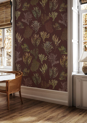 Kelp Forest Wallpaper in Garnet Red wallpaper by XV Interiors in red and green, kelp and seaweed in a styled room setting