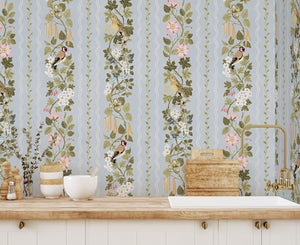 Hedgerows wallpaper by Studio Le Cocq in blue, hedgerow flowers and birds in stripes above a sideboard