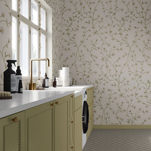 Daisy Chain wallpaper by Studio Le Cocq in cream, trailing daisy chains behind bar stools
