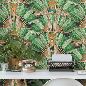 Leopard wallpaper by Brand McKenzie in green and cream behind a desk in a home office (alternate view)
