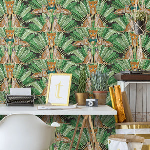 Leopard wallpaper by Brand McKenzie in green and cream, leopards among palm fronds above a work desk