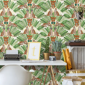 Leopard wallpaper by Brand McKenzie in green and cream, leopards among palm fronds behind a desk in a home office