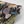 Les Plumes wallpaper by Tatie Lou in black, sample roll showing exotic birds and blooms
