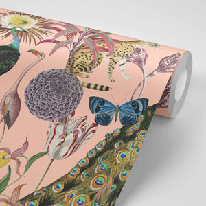Les Plumes wallpaper by Tatie Lou in pink, partly unrolled roll showing exotic birds and blooms