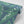 Lily of the Valley wallpaper by Annika Reed in blue and green, roll showing lily of the valley