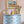 Lulu wallpaper by Parker and Jules in green and pink, a small geometric print above a sideboard