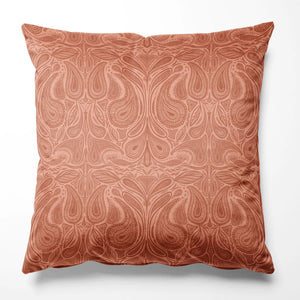 Margaux velvet by Tatie Lou in coral, marbled swirls as a cushion