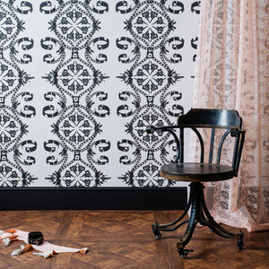 Body Lace voile fabric by The Monkey Puzzle Tree in pink, a lace body print behind a desk in a home office