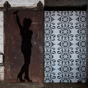 Maitrise wallpaper by The Monkey Puzzle Tree in black and white, bold graphic motifs in a styled room setting