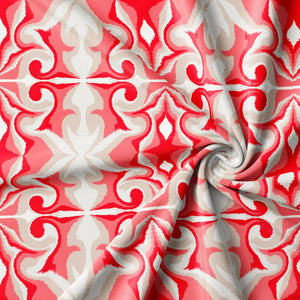 Marco Island Eco velvet by Liberty James Studio in pink, draped, showing a scrolling damask design