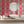 Marco Island wallpaper by Liberty James Studio in pink, sample roll showing a scrolling damask design