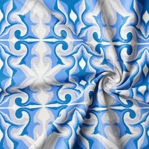 Marco Island Eco velvet by Liberty James Studio in blue, in soft folds showing a scrolling damask design