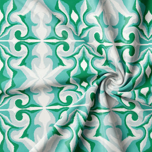 Marco Island Eco velvet by Liberty James Studio in green, draped close-up of a scrolling damask design