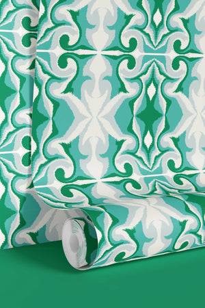 Marco Island wallpaper by Liberty James Studio in green, partly unrolled roll showing a scrolling damask design